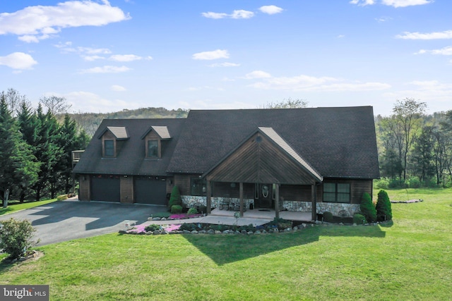 new england style home featuring stone siding, a garage, aphalt driveway, a porch, and a front yard