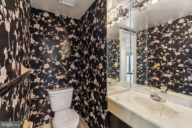 half bath with vanity and toilet