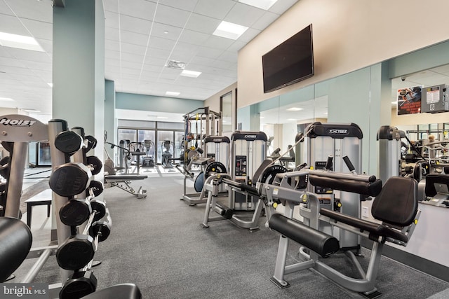 gym featuring a drop ceiling
