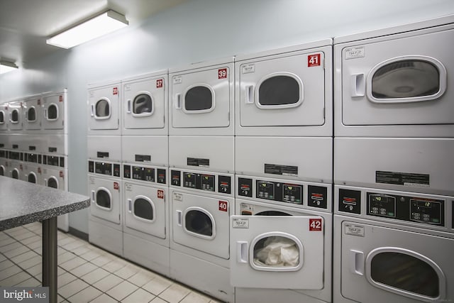 10401 Grosvenor Pl Unit 825, Rockville, MD 20852 - shared laundry area featuring stacked washer / drying machine, independent washer and dryer, and light tile patterned flooring