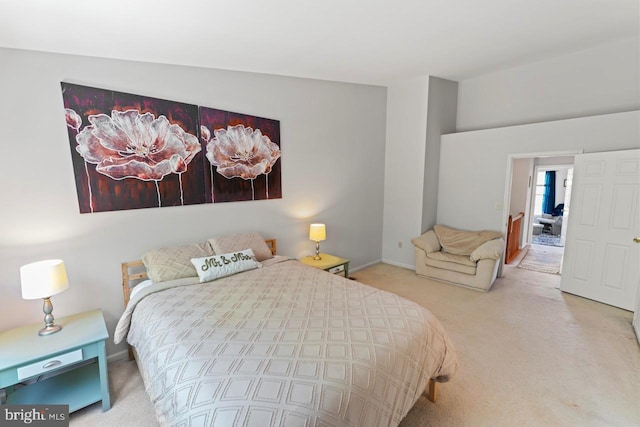 bedroom featuring light carpet