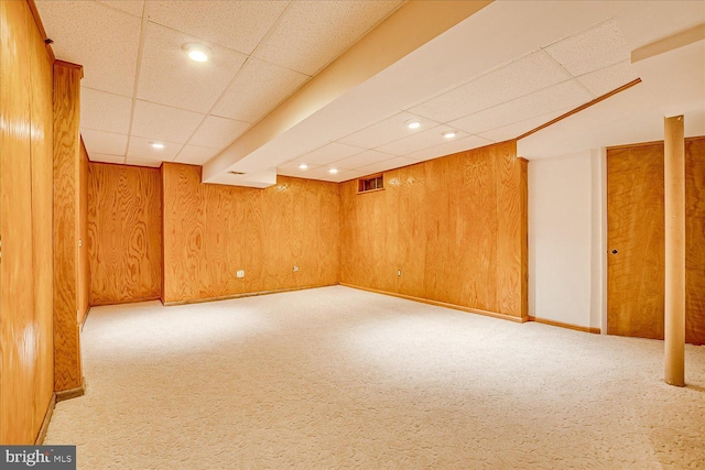 finished basement featuring carpet flooring, recessed lighting, and a drop ceiling