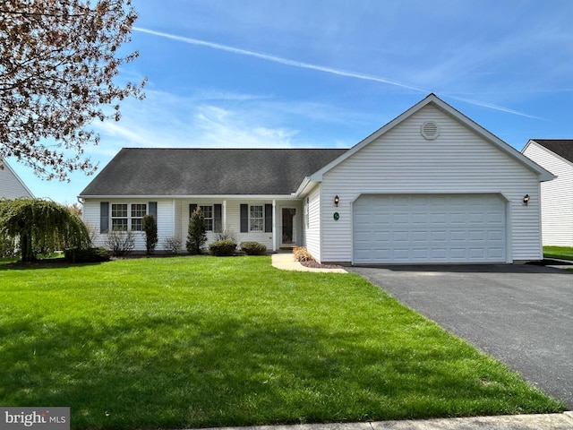 single story home with driveway, a shingled roof, a front yard, and a garage