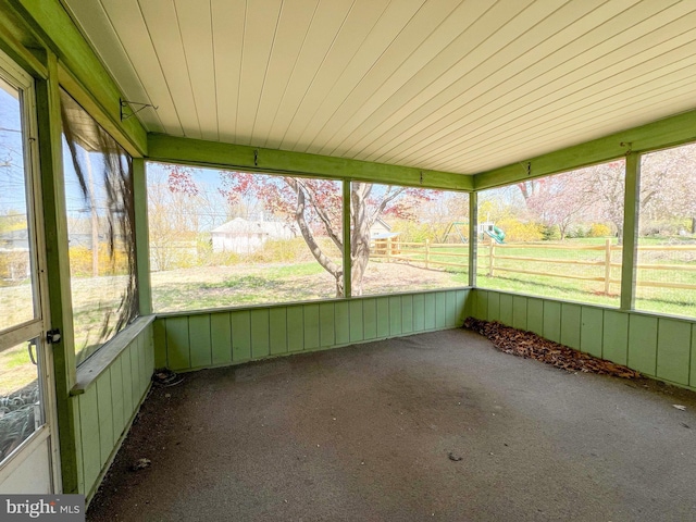 unfurnished sunroom featuring plenty of natural light