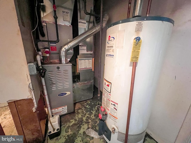 utility room with heating unit and water heater