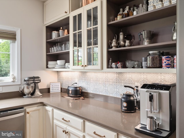 interior space featuring open shelves, decorative backsplash, and dishwasher