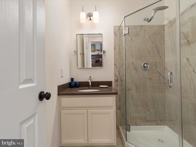 full bathroom featuring vanity and a stall shower