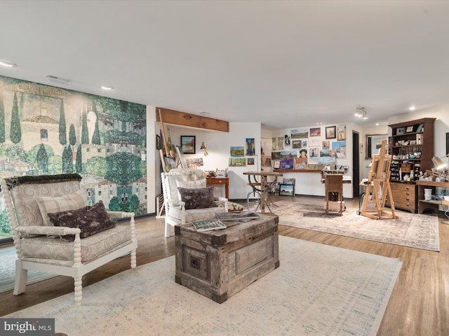 living room with recessed lighting and wood finished floors
