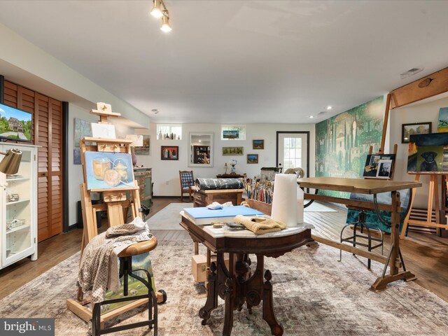 dining space with visible vents and wood finished floors