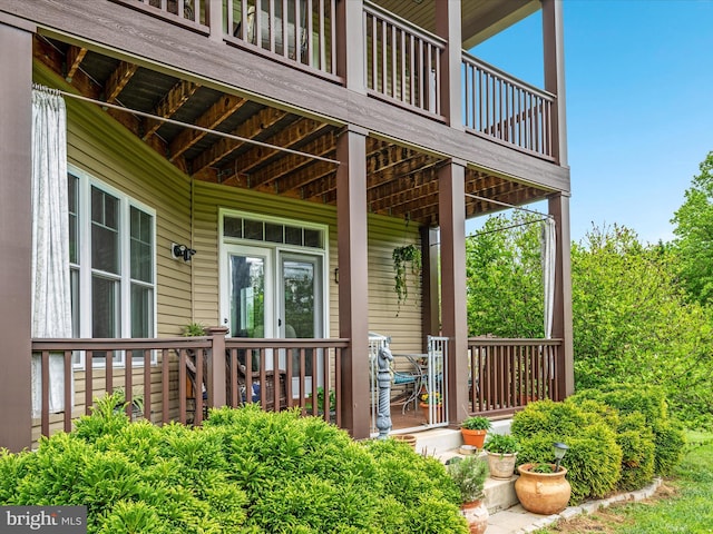 view of exterior entry with covered porch