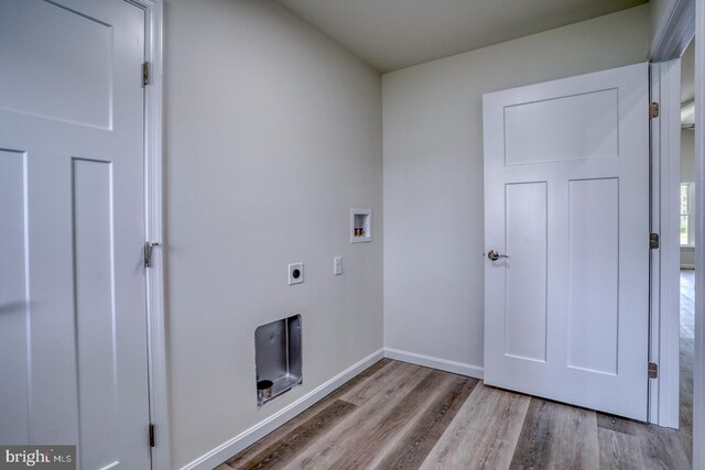 237 Plantation Dr, Felton, DE 19943 - laundry area with baseboards, hookup for a washing machine, wood finished floors, electric dryer hookup, and laundry area