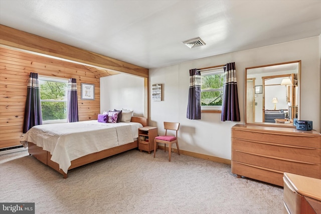 93 Shady Ln, Boyertown, PA 19512 - carpeted bedroom featuring wooden walls, baseboards, multiple windows, and visible vents