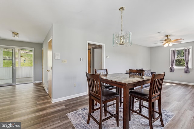 93 Shady Ln, Boyertown, PA 19512 - dining area with baseboards, wood finished floors, and ceiling fan with notable chandelier