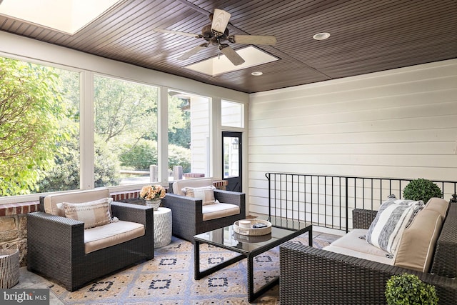 sunroom / solarium with outdoor lounge area, ceiling fan, and plenty of natural light