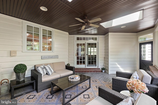view of patio featuring an outdoor living space and ceiling fan