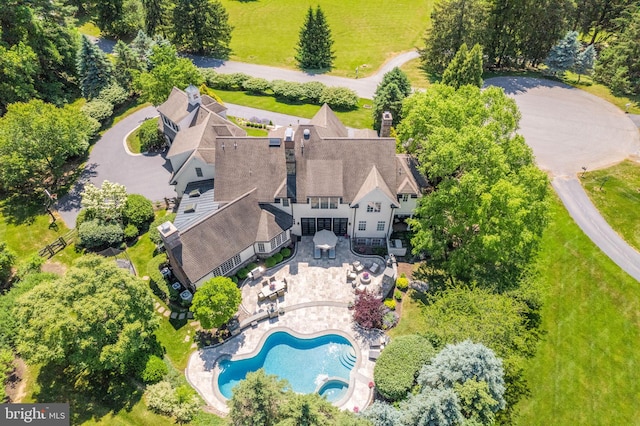 view of subject property featuring a pool