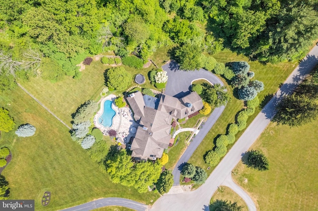 view of property location featuring a pool