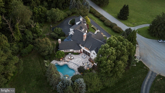 aerial view of property's location with a pool area