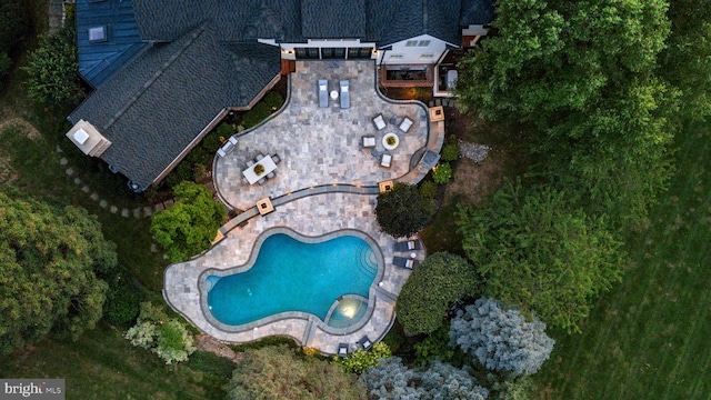 view of property location with a pool area