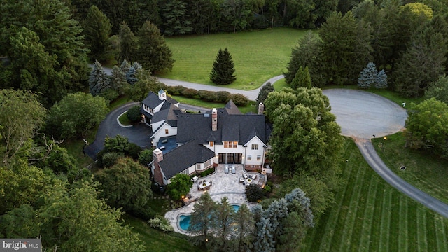 aerial view of property's location featuring a pool area