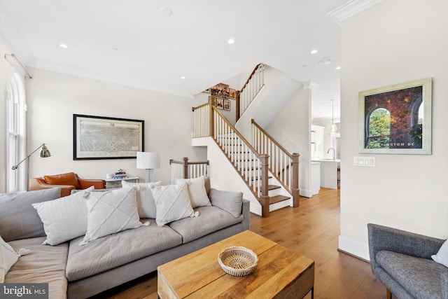 living room with stairway, wood finished floors, and recessed lighting