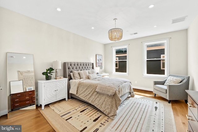 bedroom with recessed lighting, visible vents, and light wood-style flooring