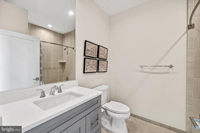 full bath featuring toilet, a tile shower, tile patterned flooring, and vanity