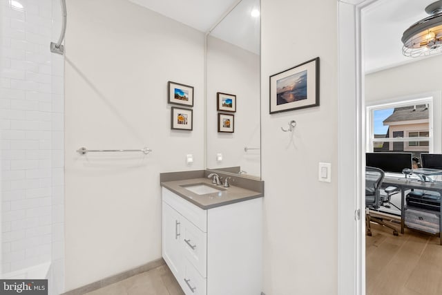 bathroom featuring a bathtub, a shower, and vanity
