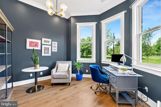 office space featuring baseboards, wood finished floors, an inviting chandelier, and crown molding