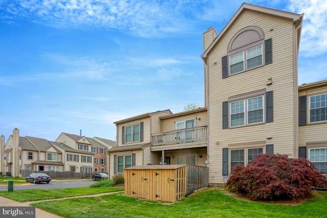 10519 Stonington Ln, Manassas, VA 20109 - rear view of house featuring a yard, an outdoor structure, and a residential view