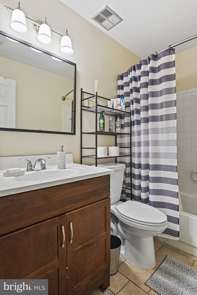 10519 Stonington Ln, Manassas, VA 20109 - full bathroom featuring toilet, vanity, visible vents, tile patterned floors, and shower / tub combo
