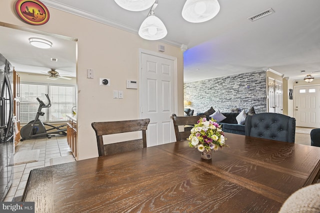 10519 Stonington Ln, Manassas, VA 20109 - dining space with light tile patterned floors, crown molding, visible vents, and a ceiling fan