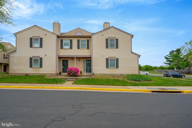 10519 Stonington Ln, Manassas, VA 20109 - view of front facade with a front lawn and a chimney