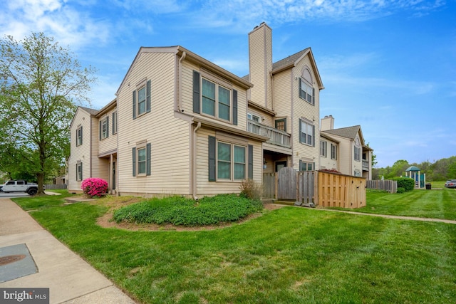 10519 Stonington Ln, Manassas, VA 20109 - view of property exterior featuring fence, a chimney, a residential view, and a lawn