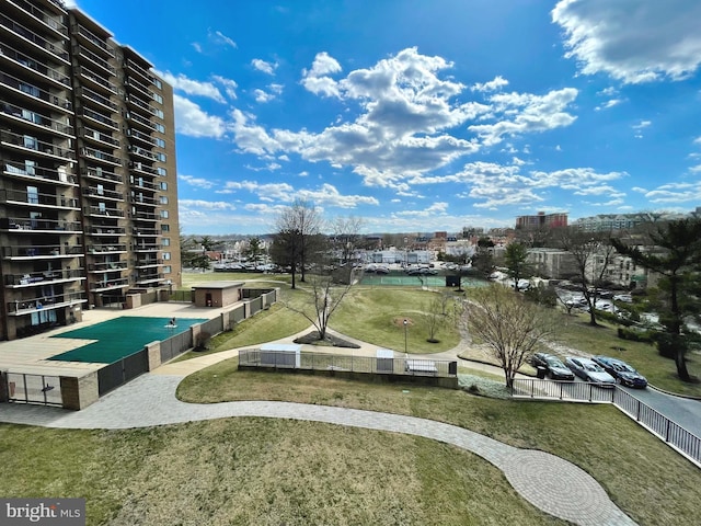 view of community with fence