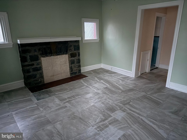 20 S Carol Blvd, Upper Darby, PA 19082 - unfurnished living room featuring a fireplace and baseboards