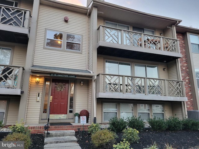 exterior space featuring central AC and a balcony