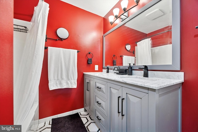 103 Debbie Ln, Phoenixville, PA 19460 - bathroom with tile patterned floors, double vanity, baseboards, and a sink