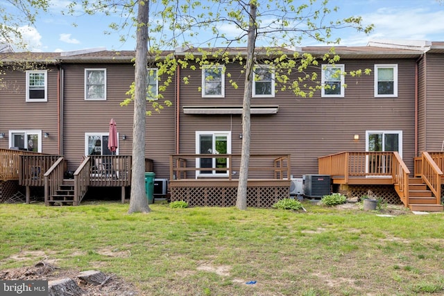 103 Debbie Ln, Phoenixville, PA 19460 - back of property featuring cooling unit, a deck, and a lawn
