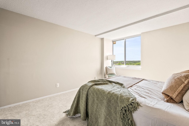 carpeted bedroom with baseboards