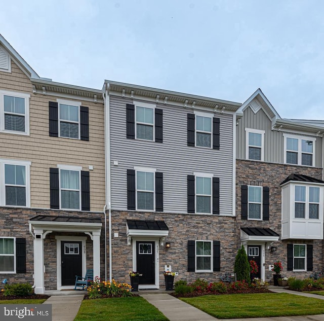 12461 Coastal Marsh Dr Unit 707, Berlin, MD 21811 - view of property featuring stone siding and board and batten siding