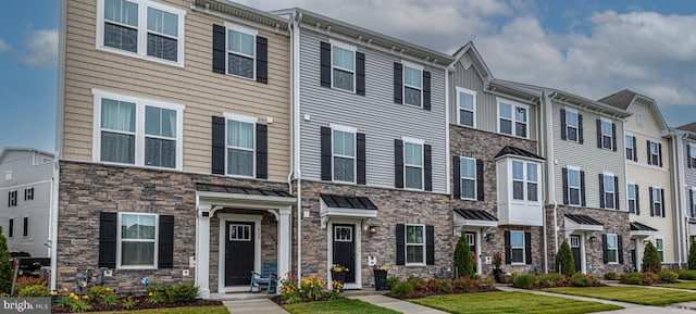 12461 Coastal Marsh Dr Unit 707, Berlin, MD 21811 - view of property featuring stone siding and a residential view