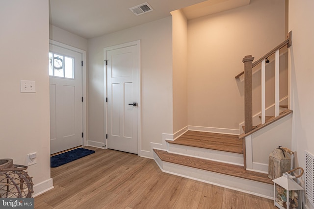 12461 Coastal Marsh Dr Unit 707, Berlin, MD 21811 - foyer entrance featuring stairs, wood finished floors, and baseboards