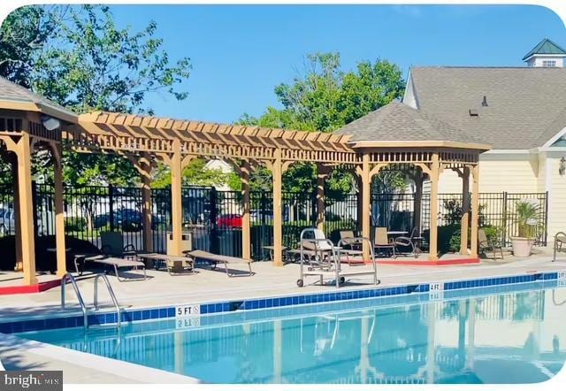 12461 Coastal Marsh Dr Unit 707, Berlin, MD 21811 - community pool with a pergola and a patio area