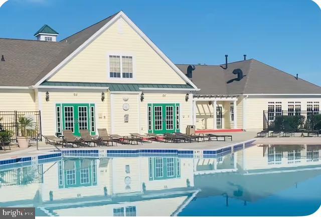 12461 Coastal Marsh Dr Unit 707, Berlin, MD 21811 - community pool featuring french doors and a patio area