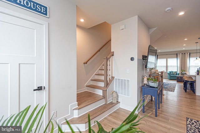 12461 Coastal Marsh Dr Unit 707, Berlin, MD 21811 - stairs featuring recessed lighting, wood finished floors, and baseboards
