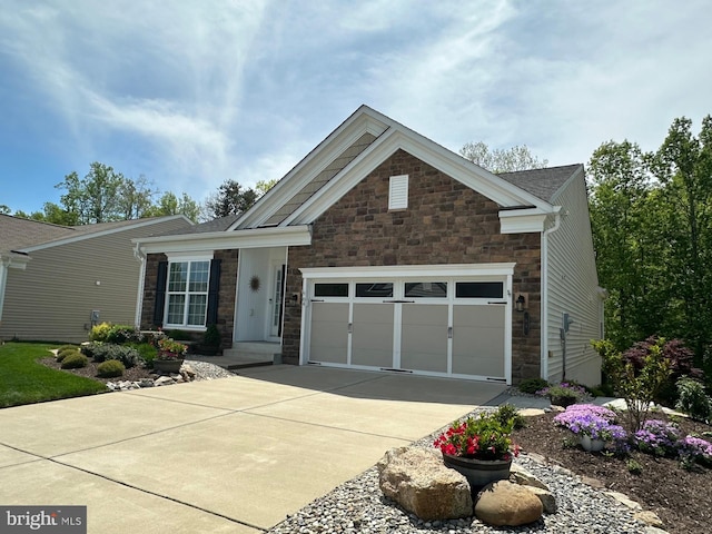 84 Battery Point Dr, Fredericksburg, VA 22406 - craftsman-style home featuring stone siding, concrete driveway, and a garage