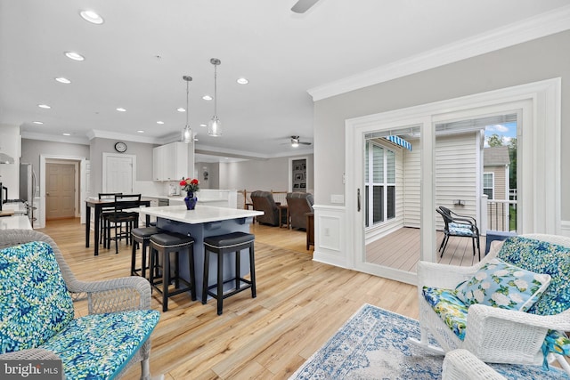 84 Battery Point Dr, Fredericksburg, VA 22406 - living room with ceiling fan, crown molding, light wood-type flooring, recessed lighting, and wainscoting