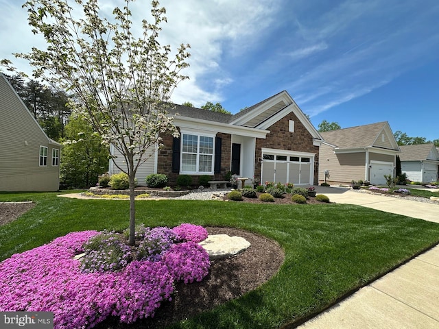 84 Battery Point Dr, Fredericksburg, VA 22406 - view of front of house with concrete driveway, an attached garage, a front yard, and stone siding