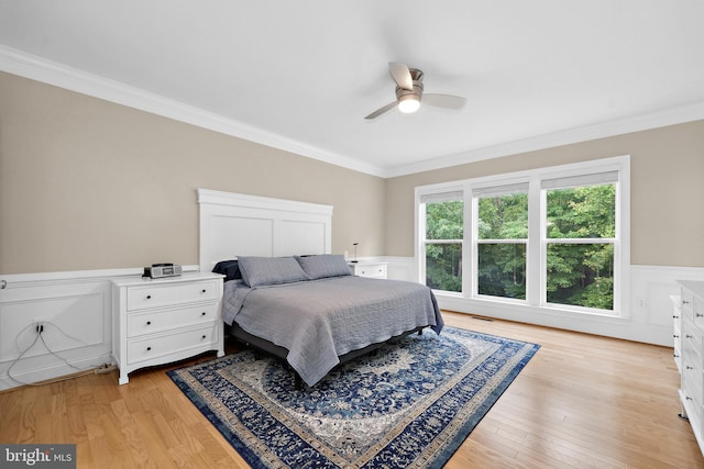 84 Battery Point Dr, Fredericksburg, VA 22406 - bedroom featuring wainscoting, ornamental molding, light wood-type flooring, and ceiling fan
